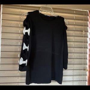 CeCe, black cold shoulder top with open cut work sleeve.